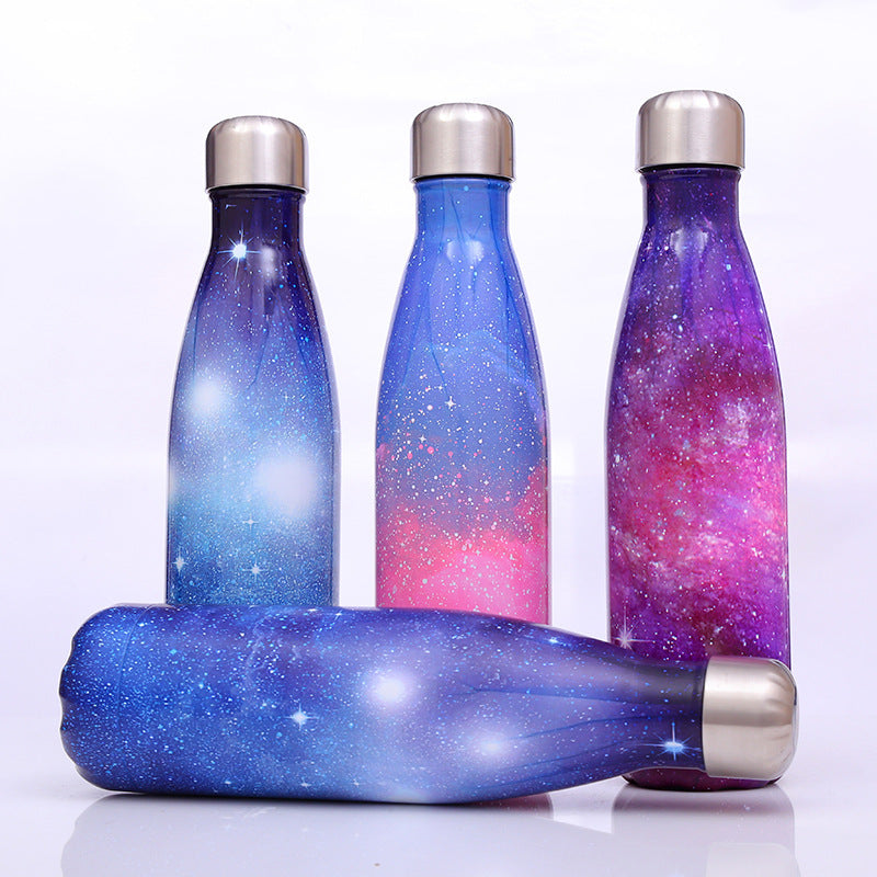 Image for a set of stainless steel vacuum flasks with sky galaxy style printing in blue, purple and pink color shades.