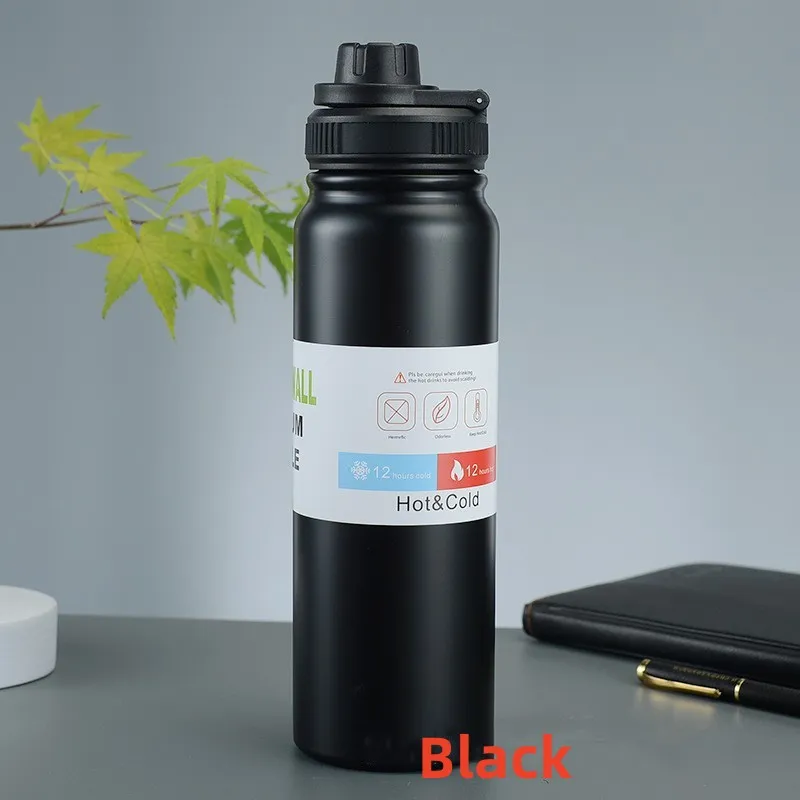Image for black stainless steel double wall insulated water bottle placed upright on the table.