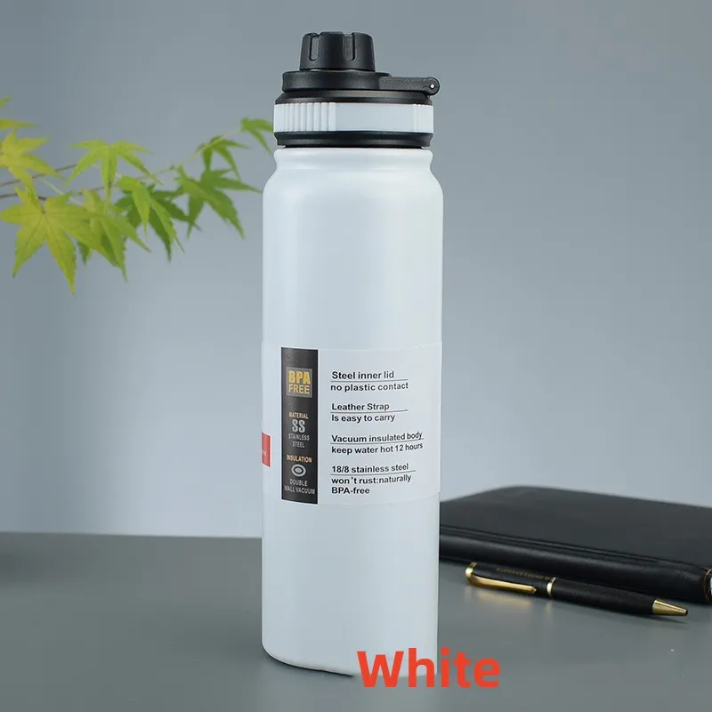 Image for the white stainless steel double wall insulated water bottle placed upright on the table.