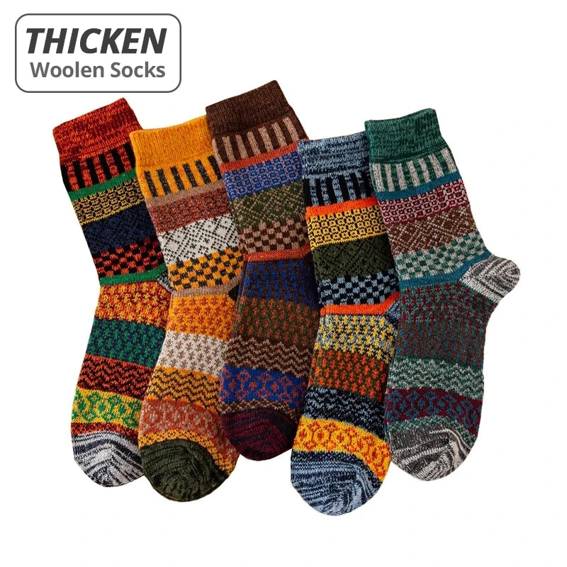 5 pairs of thick woolen socks with various patterns on a white background.