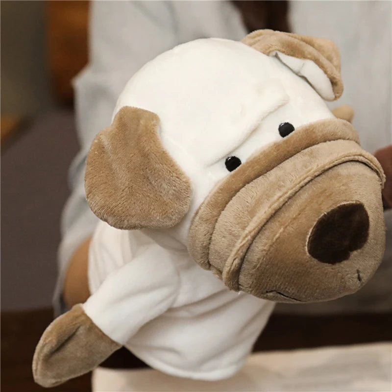 A white dog plush hand puppet with a blurred background