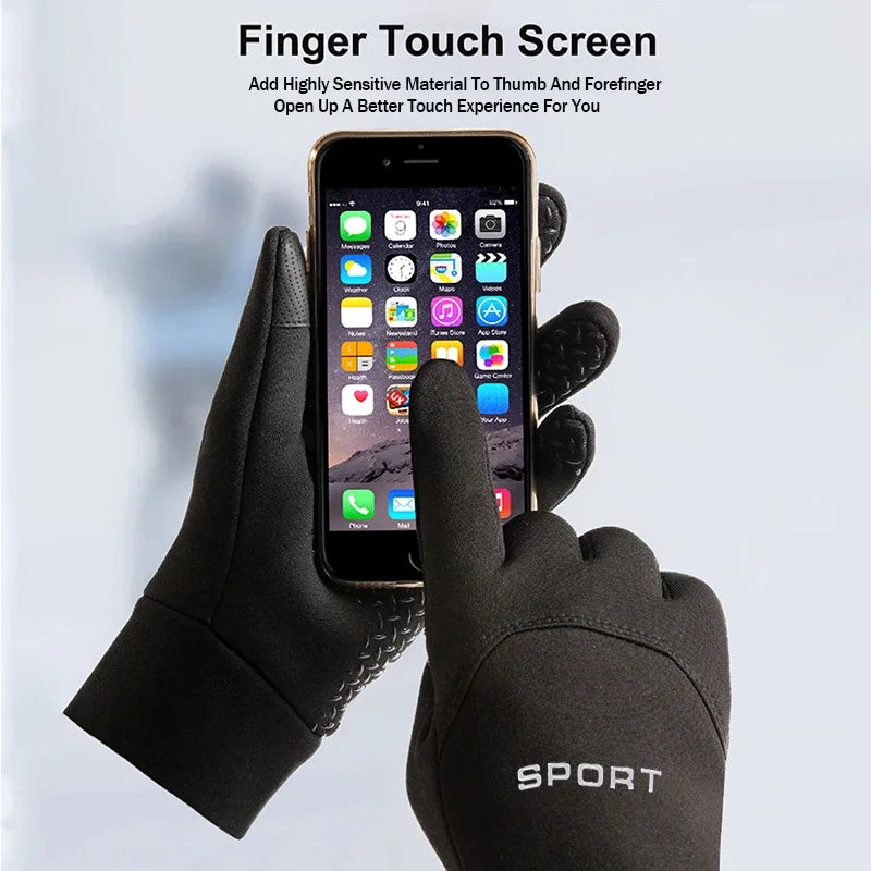 Black touchscreen gloves being used to operate a smartphone on a light gray background