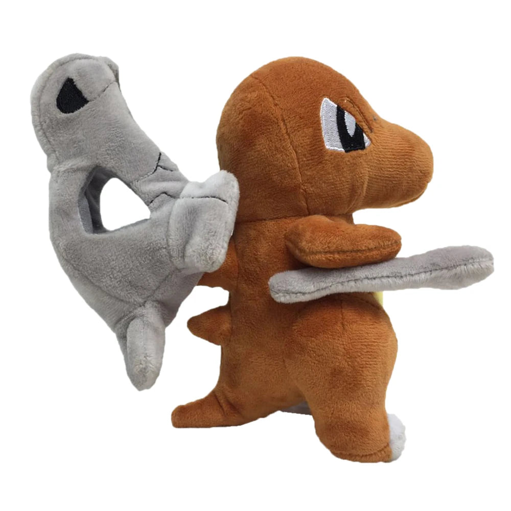 Cubone plush toy resembling with a brown body and gray wings on a white background