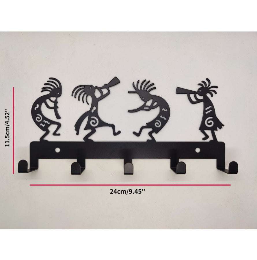 Decorative wall hook with Kokopelli designs and measurements on a light gray background