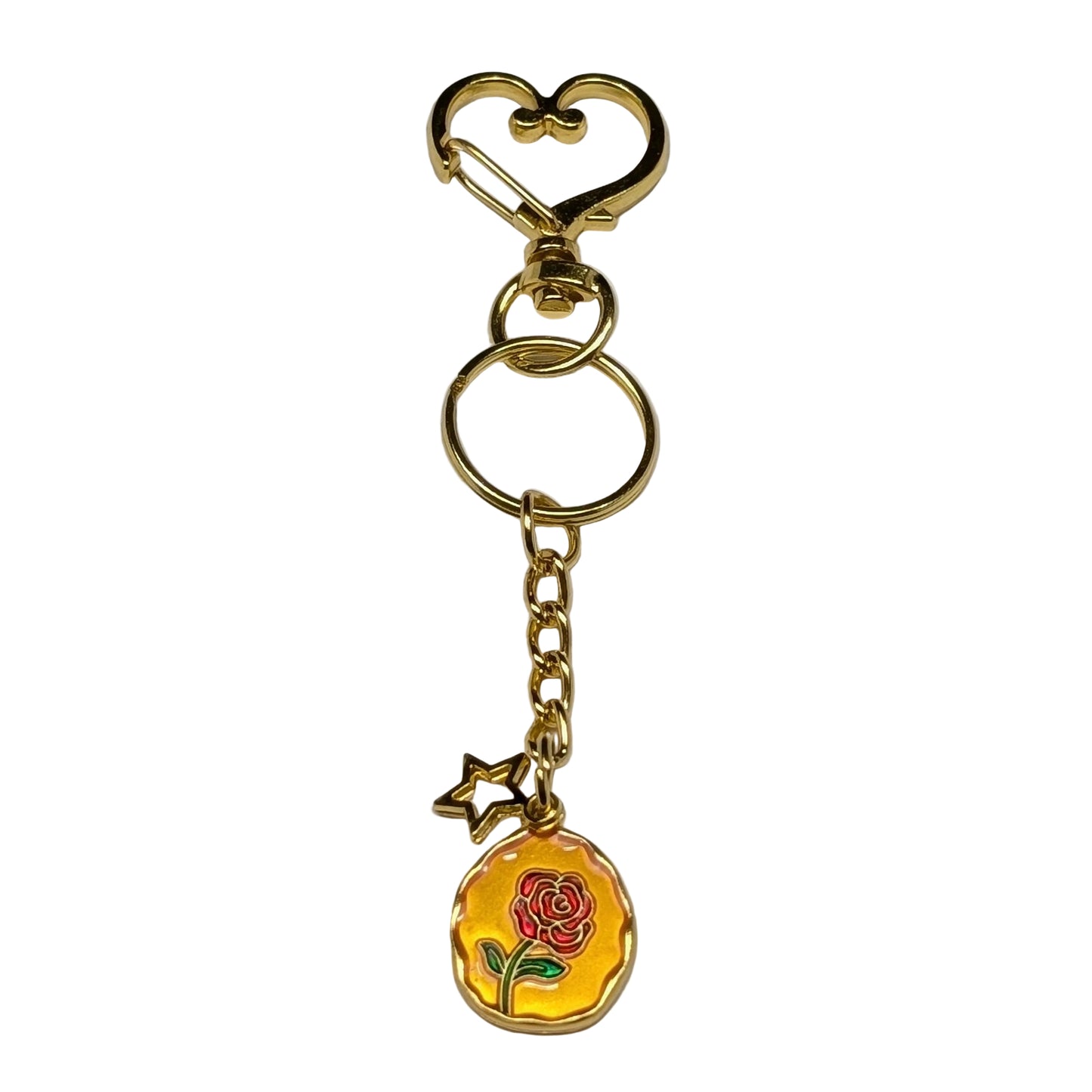 Golden heart clasp keychain with a rose charm on a gray background