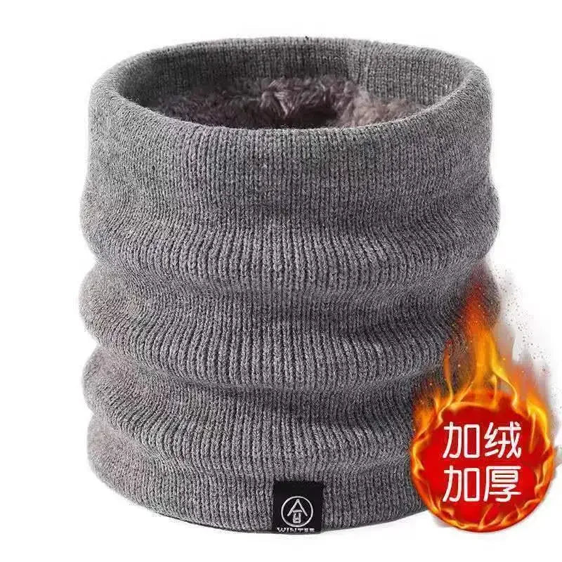 Gray knitted neck warmer with a fire sign specifying it keeps neck warm