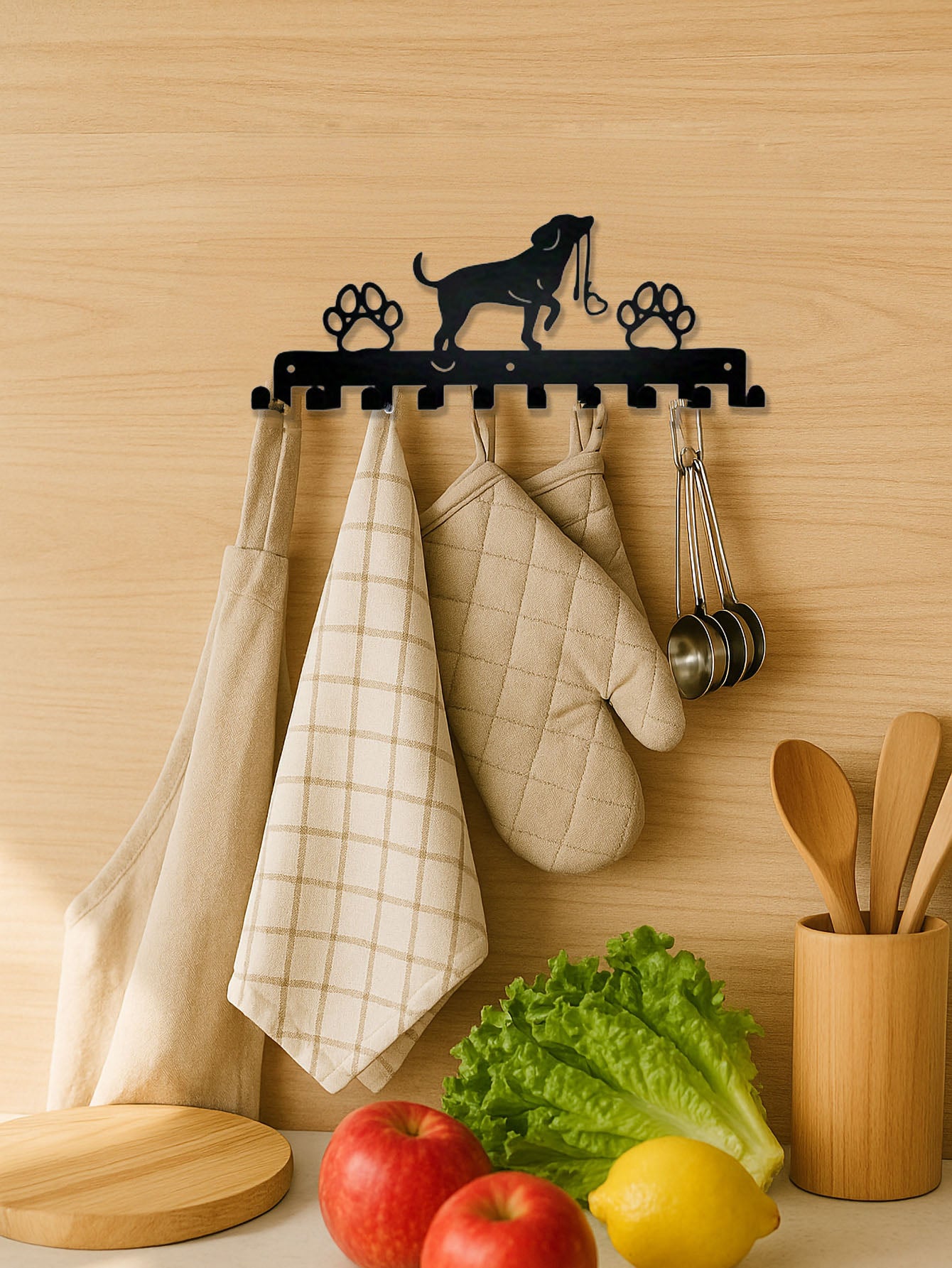 Kitchen wall with 10 hook towel rack holding kitchen items against a wooden background