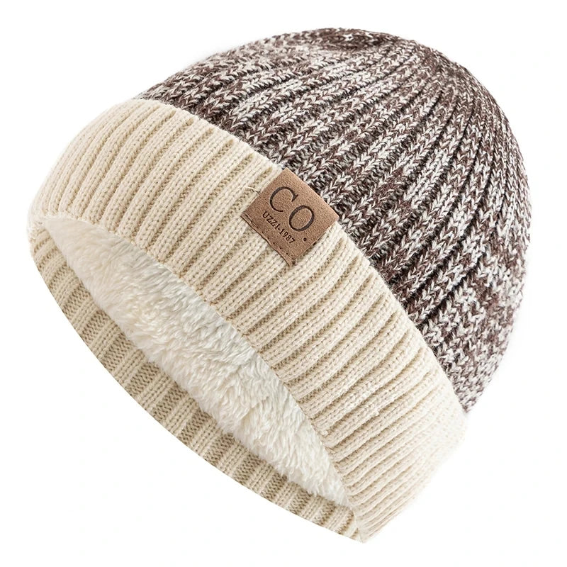 Knitted beanie with two-tone design and brand label on a white background