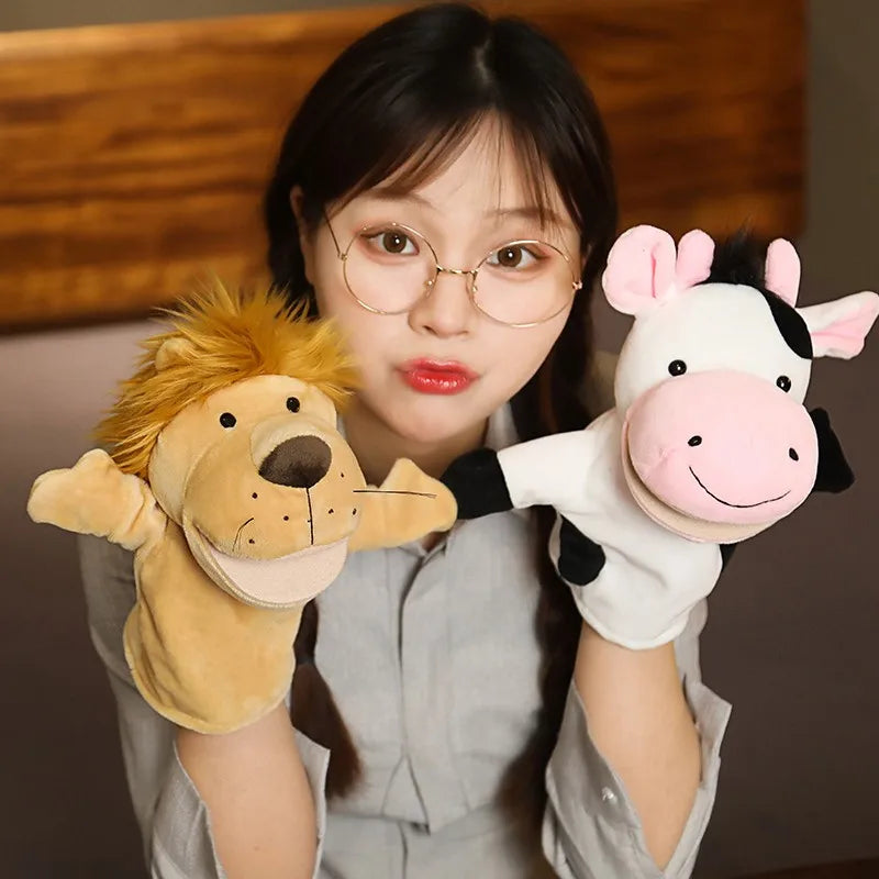 Person holding a lion and cow hand puppet with a wooden background