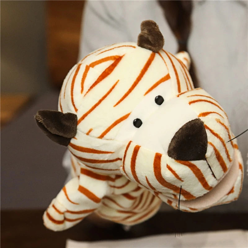 Plush hand puppet resembling a tiger held by a person