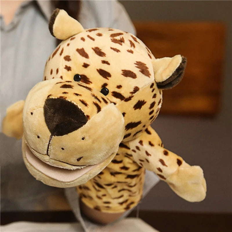 Plush leopard hand puppet held by a person with a blurred background