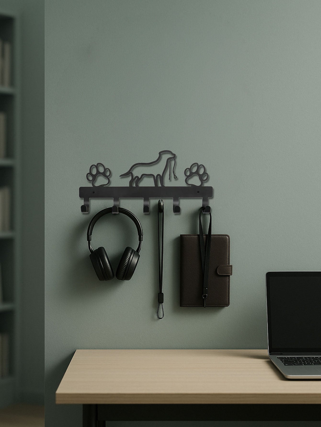 Wall-mounted 5-hook metal key and coat rack with paws & dog design hanging a headphone set, a wallet and a lanyard.