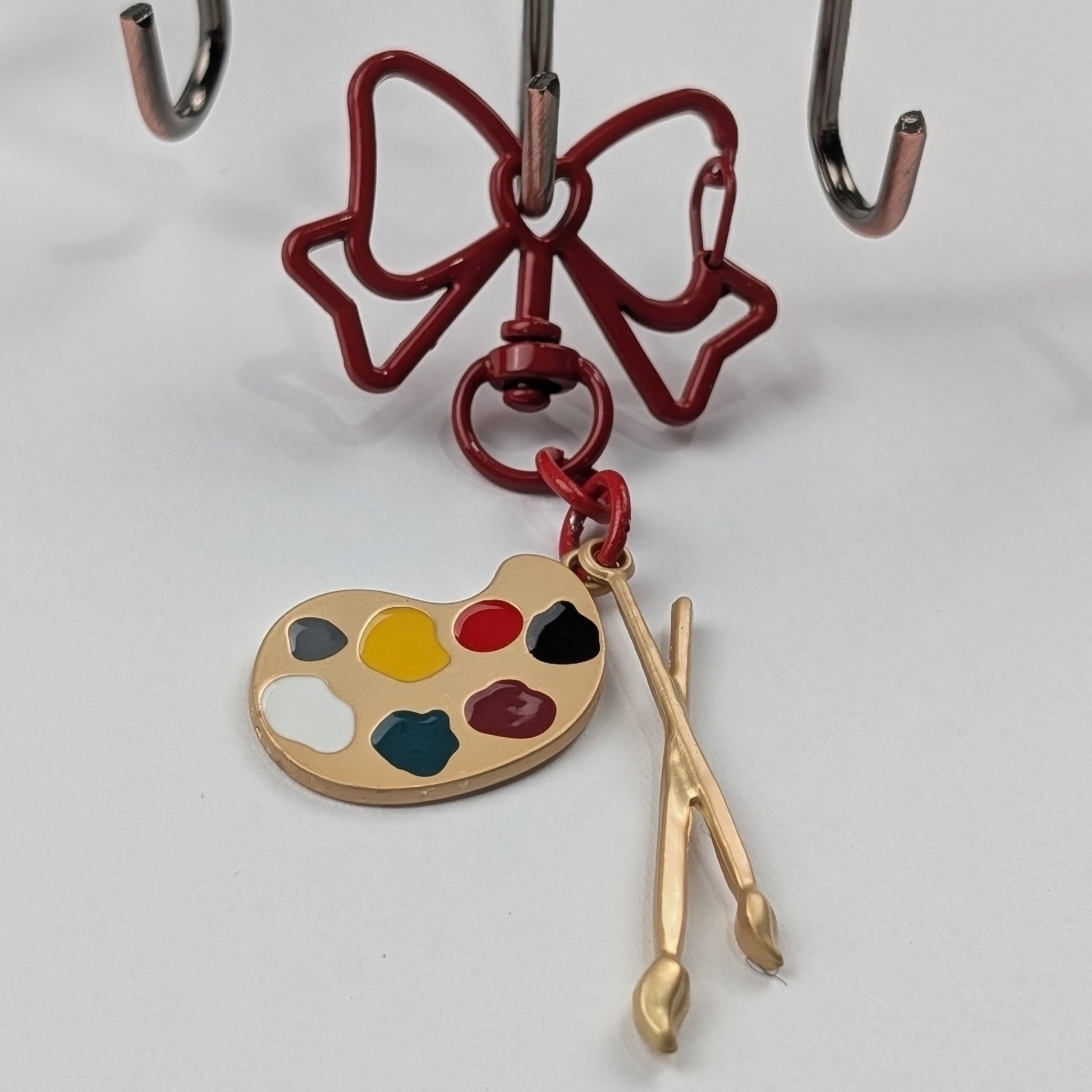 Art Palette & Paintbrush Keychain with Red Bow – Enameled Artist Bag Charm & Gift for Art Lovers - goosavvy.com