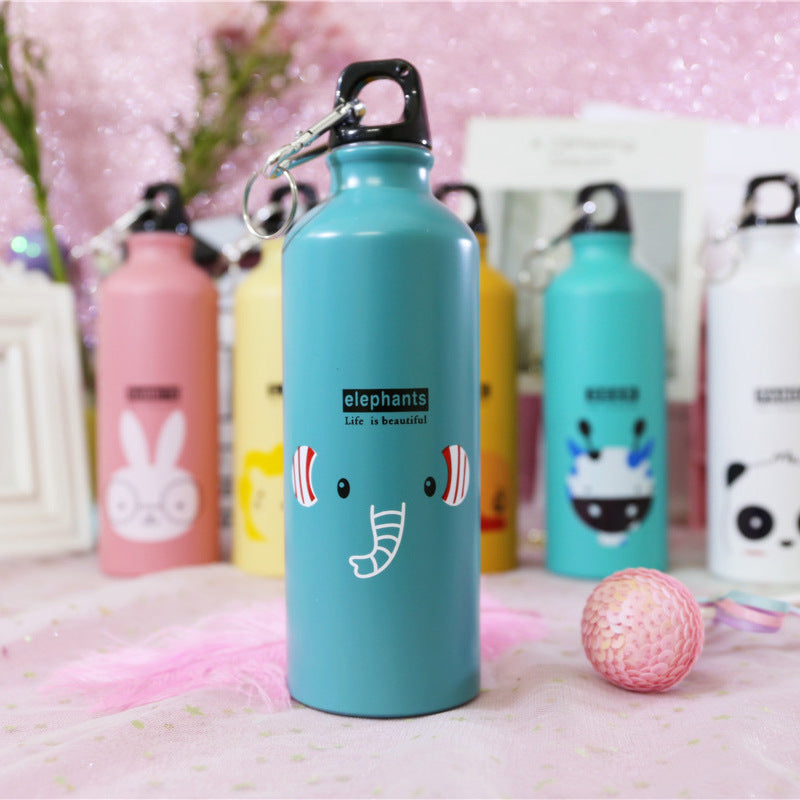 Image for stainless steel reusable water bottle for kids in blue color with elephant face print on it. It has "elephants" text right above the face and a "Life is beautiful" quote right below it. The bottle is shown standing straight with a small decoration ball lying next to it and few other similar bottles in the background.