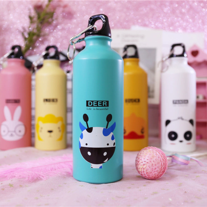 Image for stainless steel reusable water bottle for kids in blue color with fawn face print on it. It has "DEER" text right above the face and a "Life is beautiful" quote right below it. The bottle is shown standing straight with a small decoration ball lying next to it and few other similar bottles in the background.