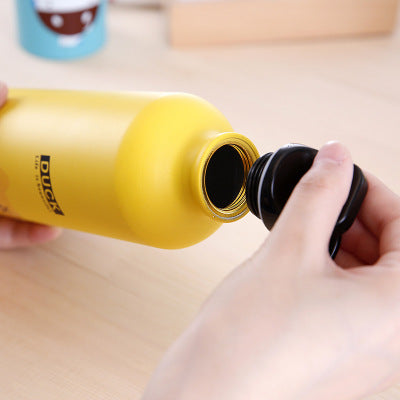 Image for stainless steel reusable water bottle for kids in yellow color with the cap opened to show its interior.