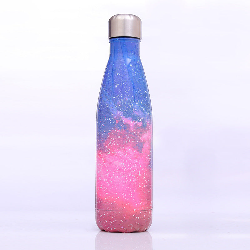 Image for stainless steel vacuum flask with sky galaxy style printing in pink color shade. The bottle has a stainless steel cap with a silicone sealing ring inside to keep it air tight when capped.