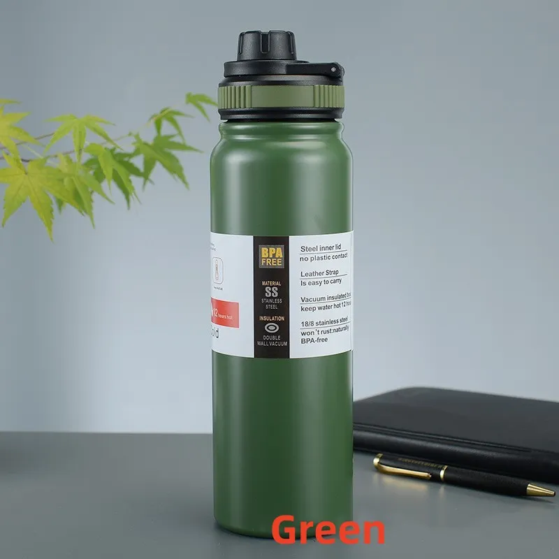Image for the green stainless steel double wall insulated water bottle placed upright on the table.