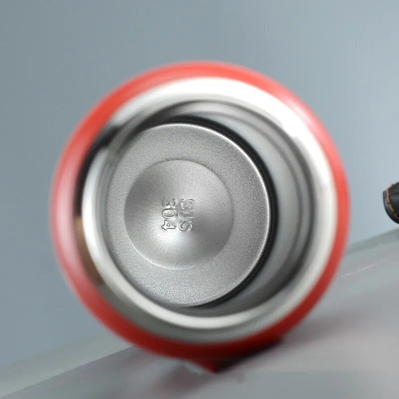 Image for stainless steel double wall insulated water bottle placed on the table without lid showing its inside view.