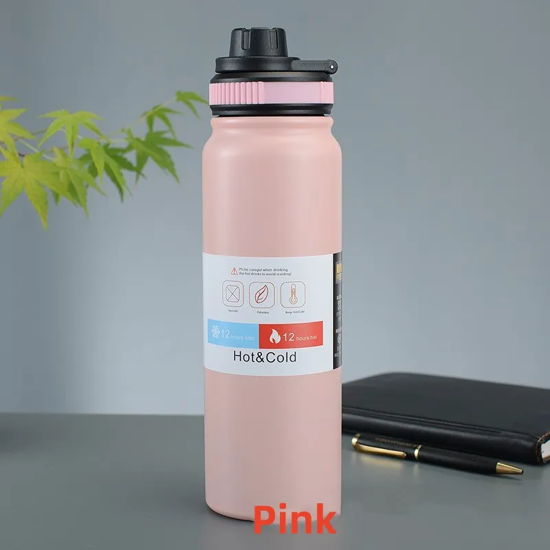 Image for the pink stainless steel double wall insulated water bottle placed upright on the table.