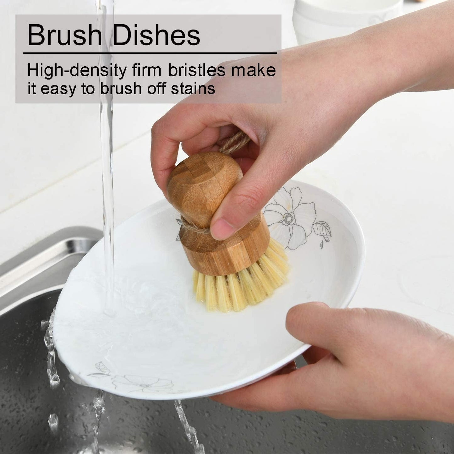 Image for a small bamboo bowl brush being used to scrub a dinner plate.