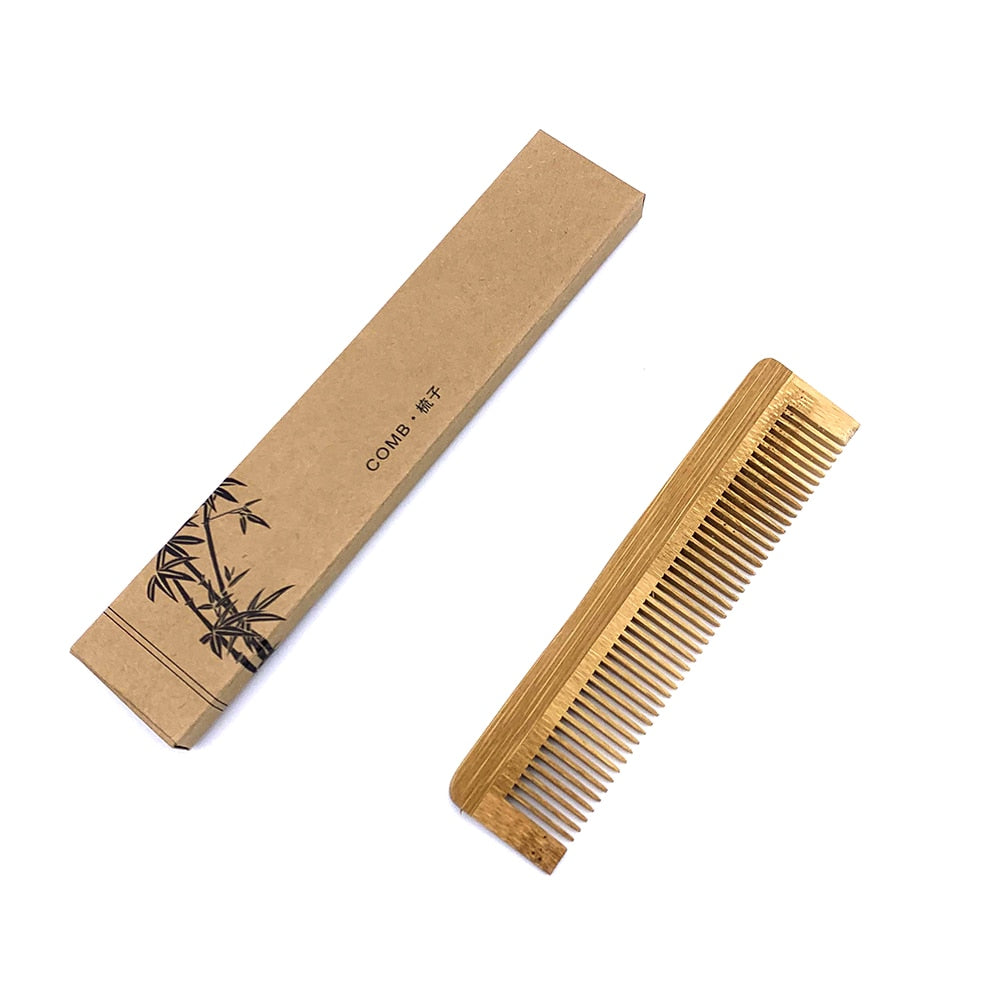 Image for bamboo wood hair comb placed next to its paper or card board packaging.