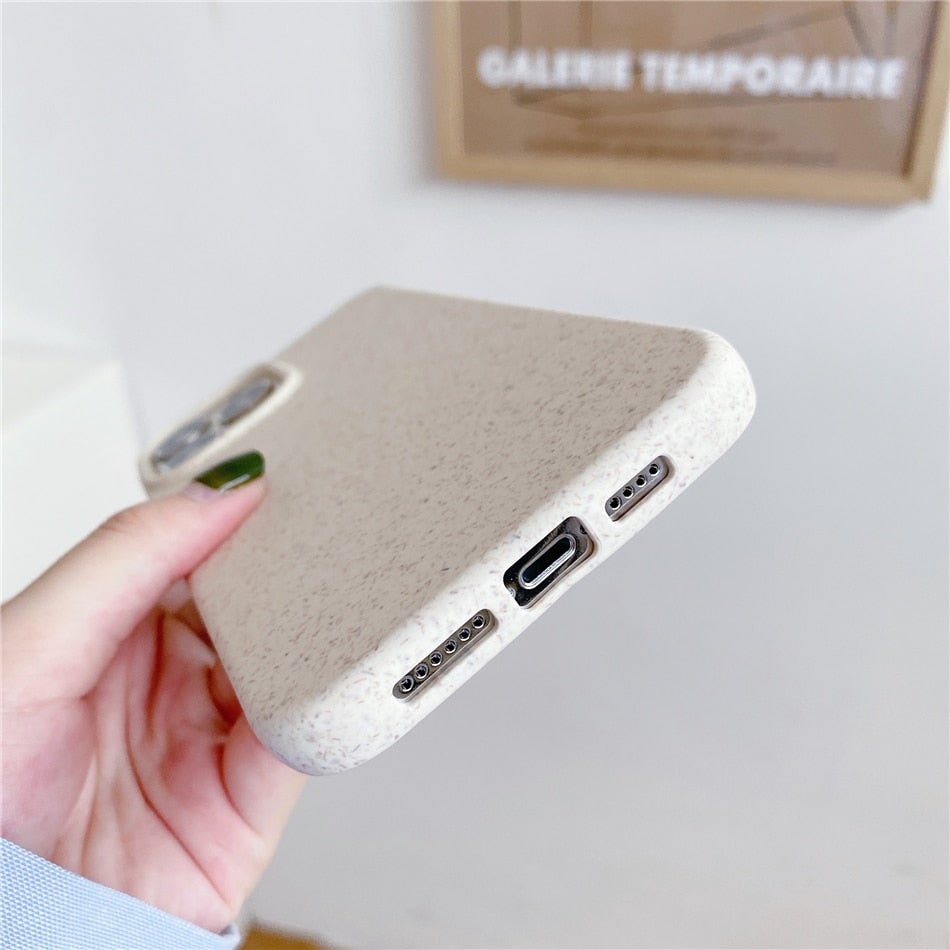 Image for wheat straw compostable phone case for iPhone showing its bottom cable input view. Phone case color is textured white.