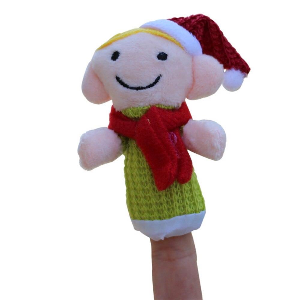 Image for small green puppet on finger. It has a red tie in the neck, slight pink face with a smiley and a white and red hat like Santa.