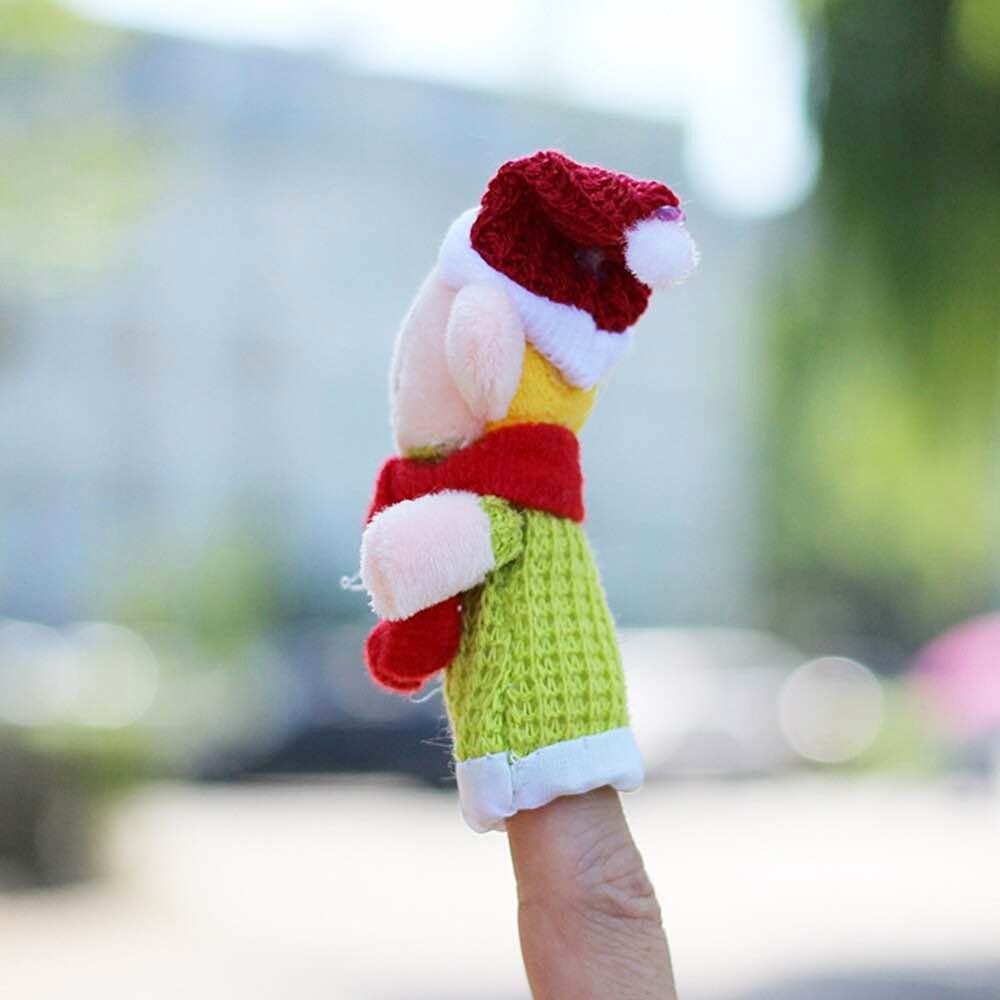 Image for small puppet on finger with its side view. It is the green puppet with red tie in the neck and Santa like hat on head.