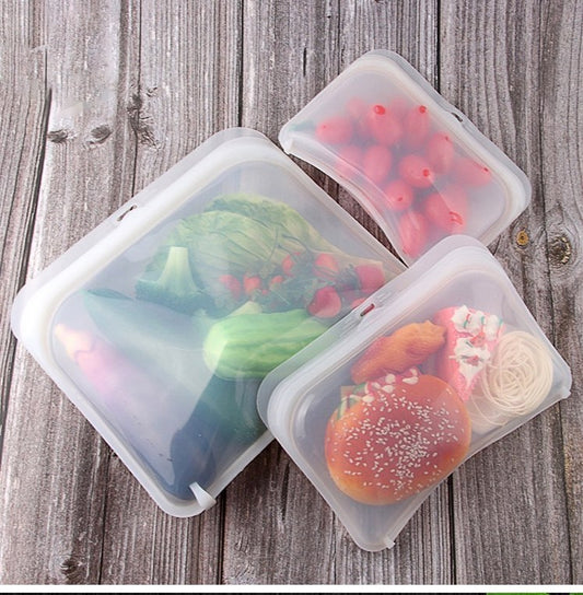 Image for three reusable silicone ziplock bags containing vegetables, noodles and bread etc.