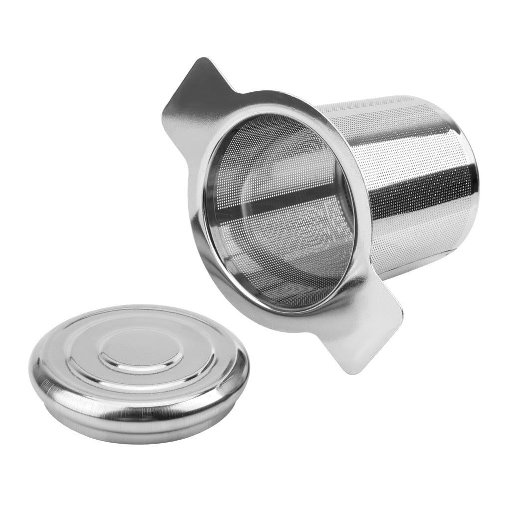 Image for stainless steel loose leaf tea infuser with handles placed on its side. The lid is placed next to it.