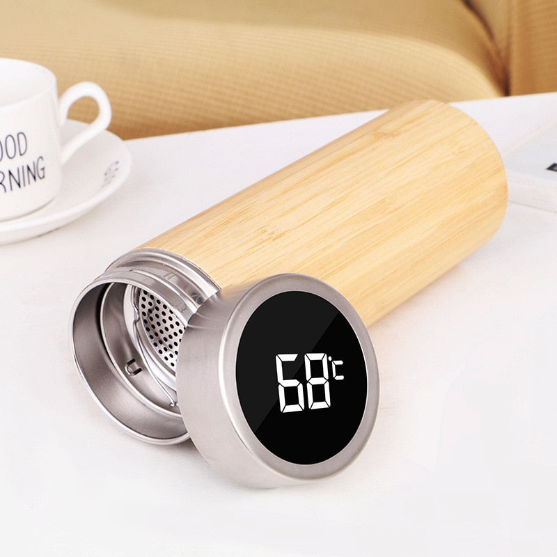 Image for stainless steel and bamboo insulated thermos flask with removable filter. The lid with LCD temperature display is placed next to it.