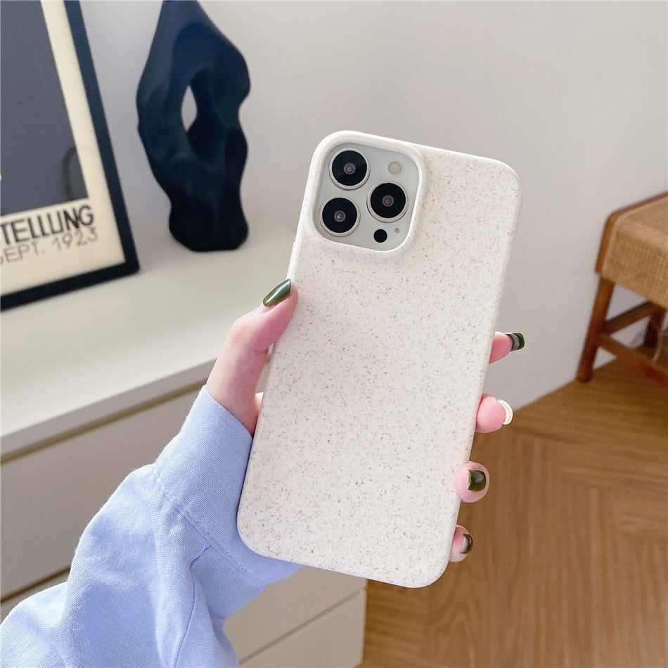 Image for iPhone in white textured wheat straw phone case in person's hand showing its full back view.